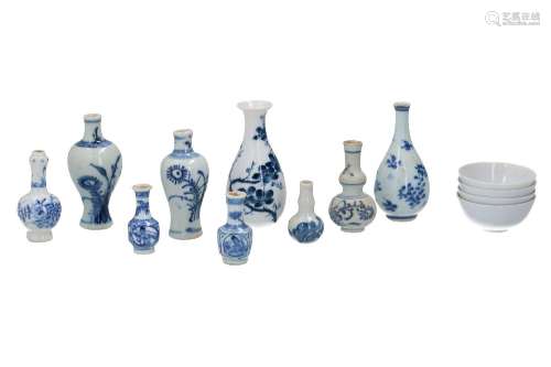 A lot of nine blue and white porcelain miniature vases, deco...