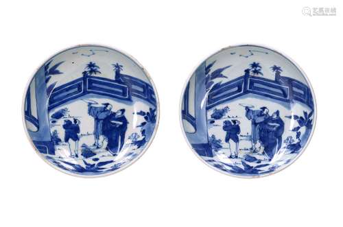 A pair of blue and white porcelain deep dishes, decorated wi...