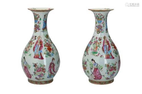 A pair of polychrome porcelain vases, decorated with immorta...