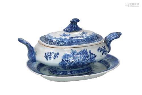 An oval blue and white porcelain lidded tureen with two grip...