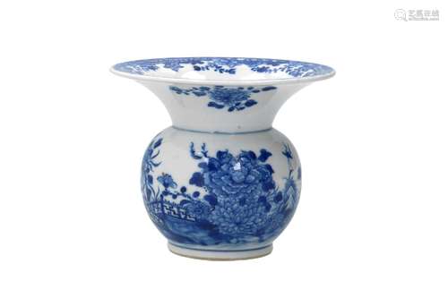 A blue and white porcelain spittoon, decorated with flowers