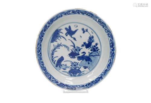 A blue and white porcelain deep dish, decorated with ducks a...