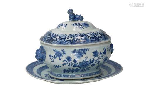 An oval blue and white porcelain lidded tureen with grips in...