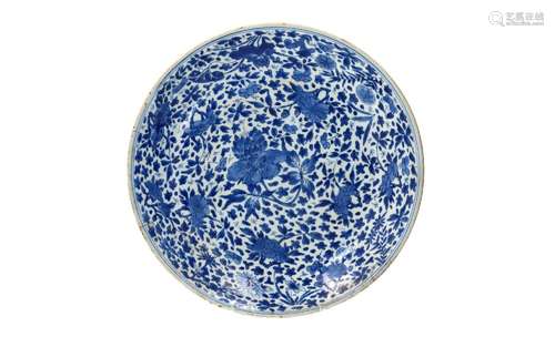 A blue and white porcelain charger, decorated with flowers