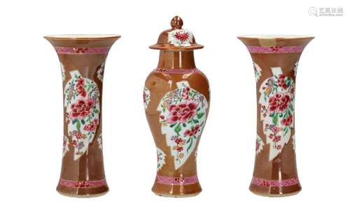 A three-piece capucine and famille rose porcelain garniture,...