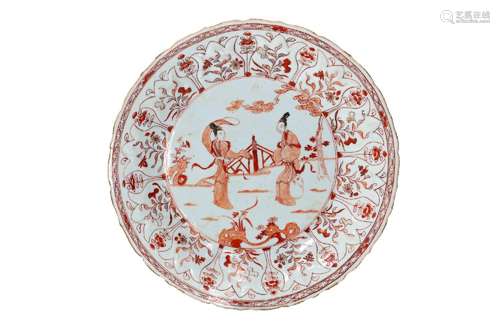 An iron red porcelain deep dish with scalloped rim, decorate...