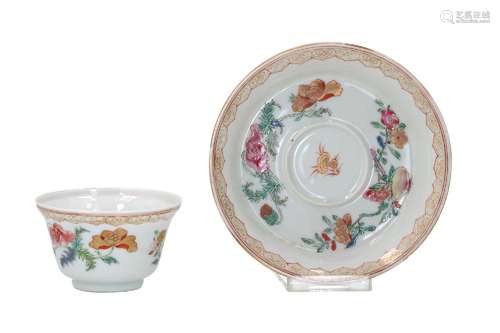 A famille rose porcelain cup with saucer, decorated with pom...