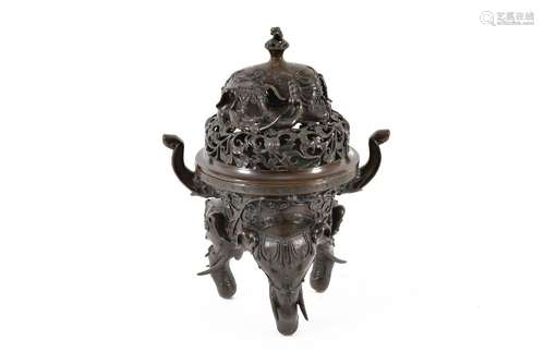 A bronze tripod incense burner