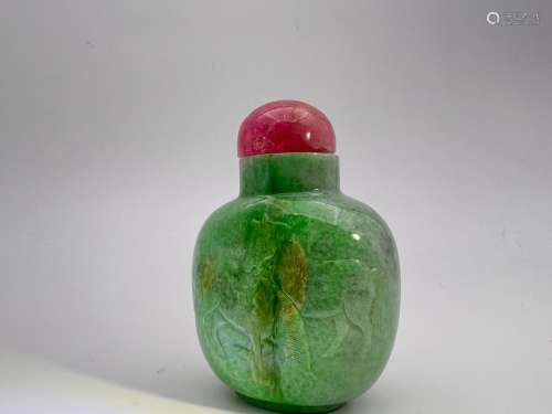 A jadeite snuff bottle encaved with two vivid horsed, Qing D...