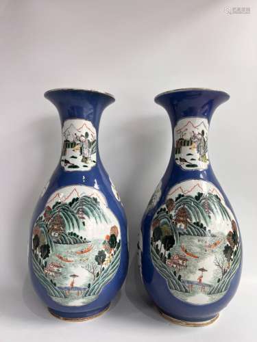 A pair of blue ground famille rose vases, Qing Dynasty.