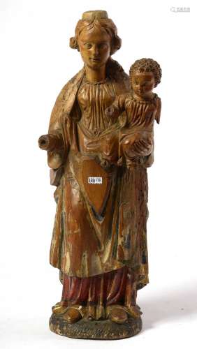 "Vierge à l'Enfant" en bois sculpté portant des tr...