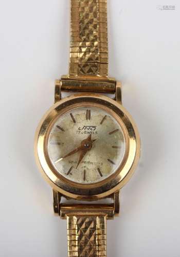 An Uno 18ct gold circular cased lady's wristwatch, the case ...