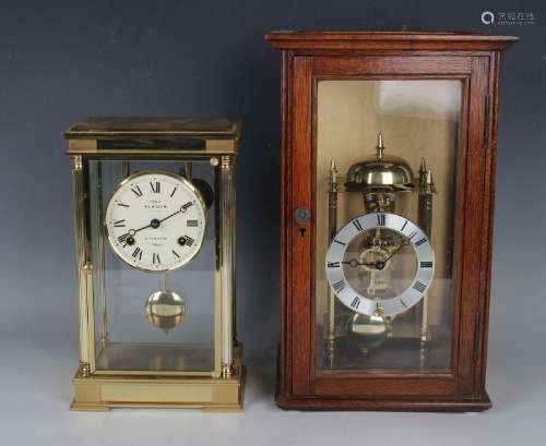 A late 20th century lacquered brass cased four glass mantel ...