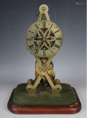 A mid-19th century brass skeleton timepiece with eight day s...