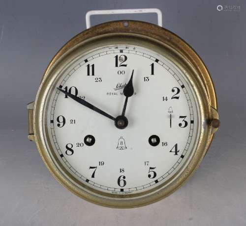 A 20th century lacquered brass ship's clock with eight day m...