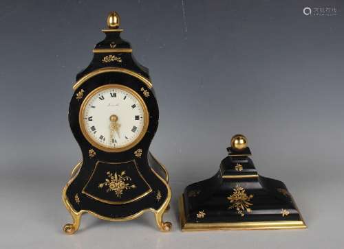A mid-20th century Zenith ebonized mantel clock and bracket,...