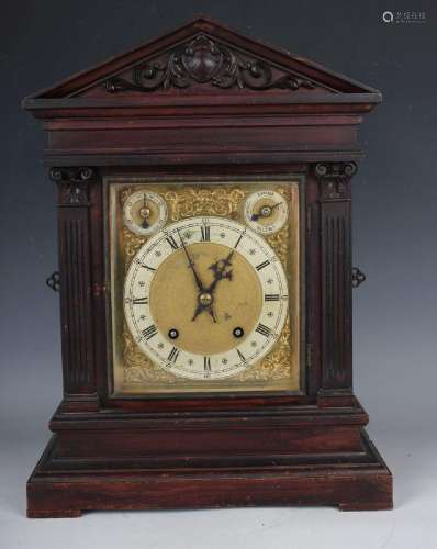 A late 19th century German oak mantel clock with eight day m...