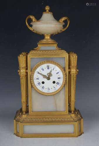 A late 19th century French ormolu and alabaster mantel clock...