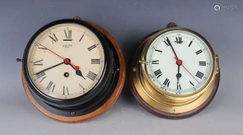 An early 20th century black enamelled brass ship's timepiece...