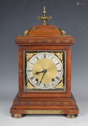 A late 19th century German brass mounted walnut mantel clock...