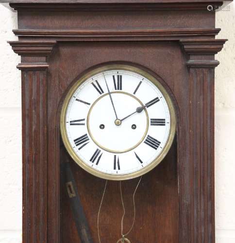 A late 19th century oak Vienna style wall clock with eight d...