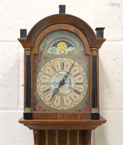 A 20th century Dutch oak cased wall clock with weight driven...