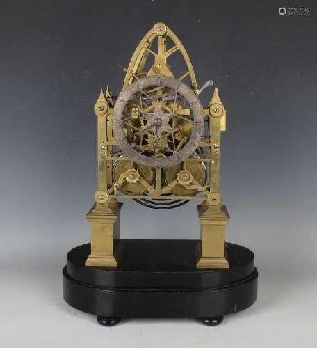 A mid to late 19th century brass skeleton clock with eight d...