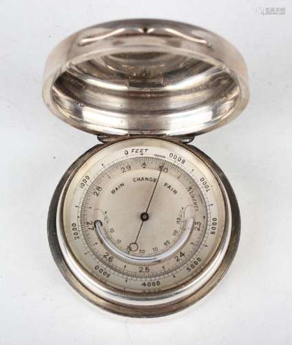 A late Victorian silver circular cased pocket aneroid barome...