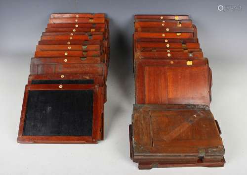 A collection of twenty-five mahogany camera plate holders.