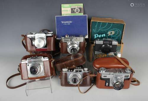 A collection of assorted cameras, including Canon Model VT c...