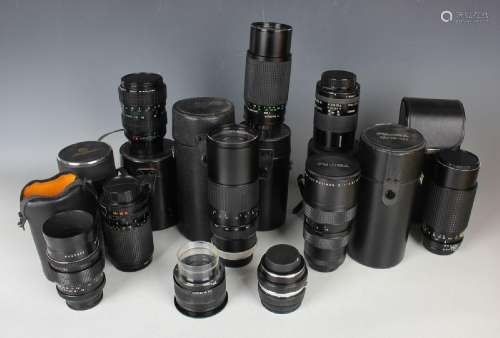 A collection of assorted camera lenses, including Tokina 80-...