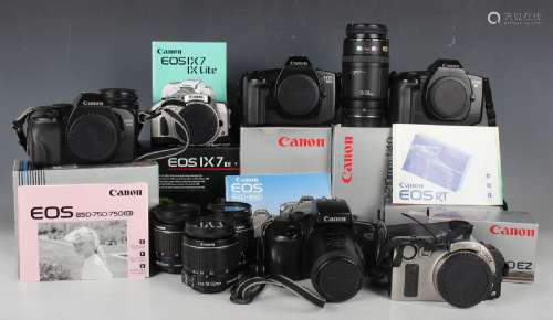 A collection of Canon cameras, lenses and accessories, compr...