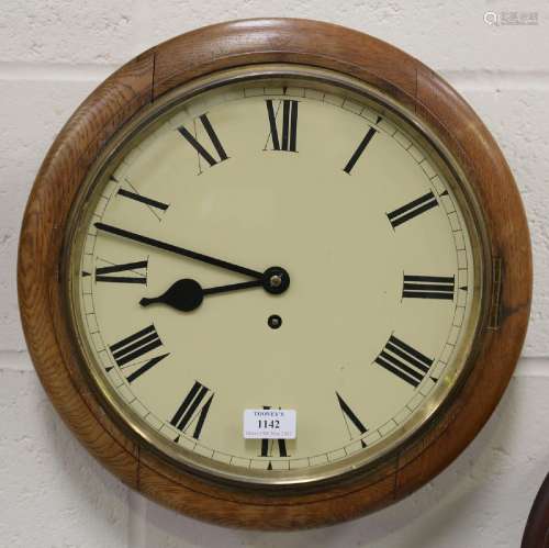 An early 20th century oak circular wall timepiece with Coven...