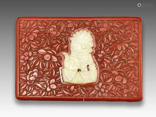 A CHINESE CINNABAR LACQUER BOX WITH JADE BUDDIHISTIC LION, Q...