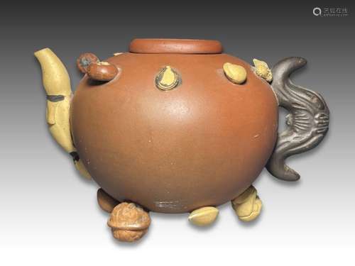 A CHINESE YIXING HUNDRED-FRUIT TEAPOT AND COVER QING DYNASTY...