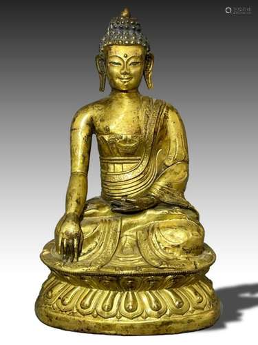 A TIBETAN GILT-BRONZE FIGURE OF THE SEATED BUDDHA, 19TH CENT...