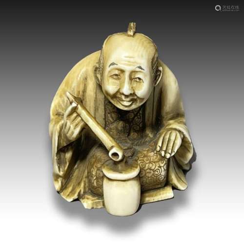 AN IVORY NETSUKE OF A STREET VENDOR, MEIJI PERIOD, 19TH CENT...