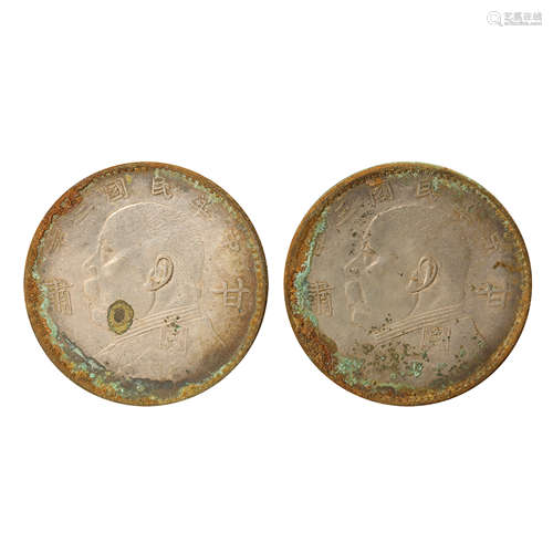 A PAIR OF CHINESE SILVER DOLLARS