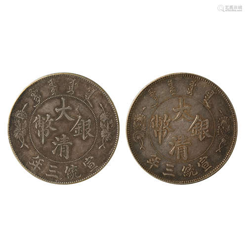 A PAIR OF CHINESE SILVER DOLLARS