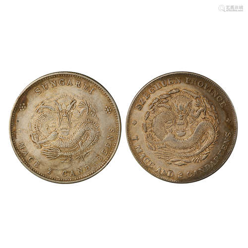 A PAIR OF CHINESE SILVER DOLLARS