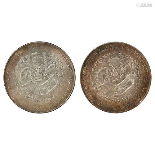 A PAIR OF CHINESE SILVER DOLLARS