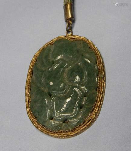 Jade pendant set in brass mount