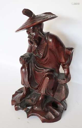 Sitzende Figur