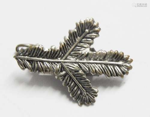 Fir branch as brooch, co