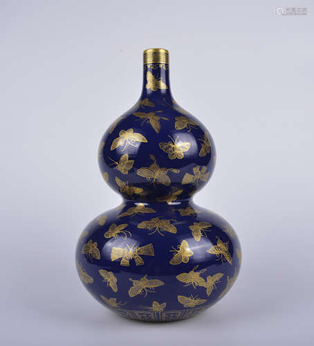 A blue glazed 'butterflies' gourd-shaped vase painting in go...