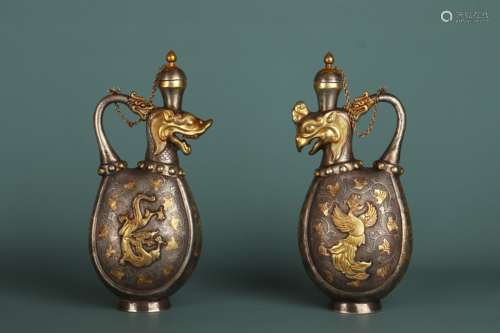 A pair of copper gilded 'phoenix' ewer