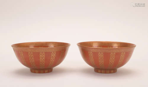 A pair of allite red glazed 'poems' bowl painting in gold