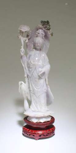 A CARVED LAVENDER COLOR JADE GUANYIN STATUE