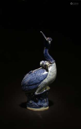 A PORCELAIN DUCK FIGURINE