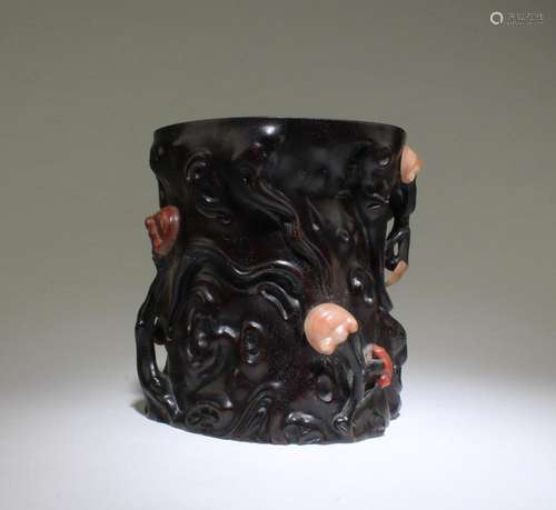 A CARVED WOODEN BRUSHPOT